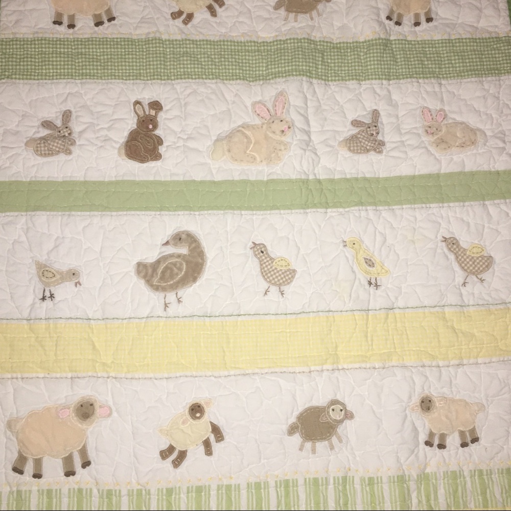 Pottery barn crib quilt and curtain top.